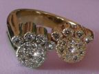 A Spectacular Double Paw Ring in White and Yellow Gold with Diamonds